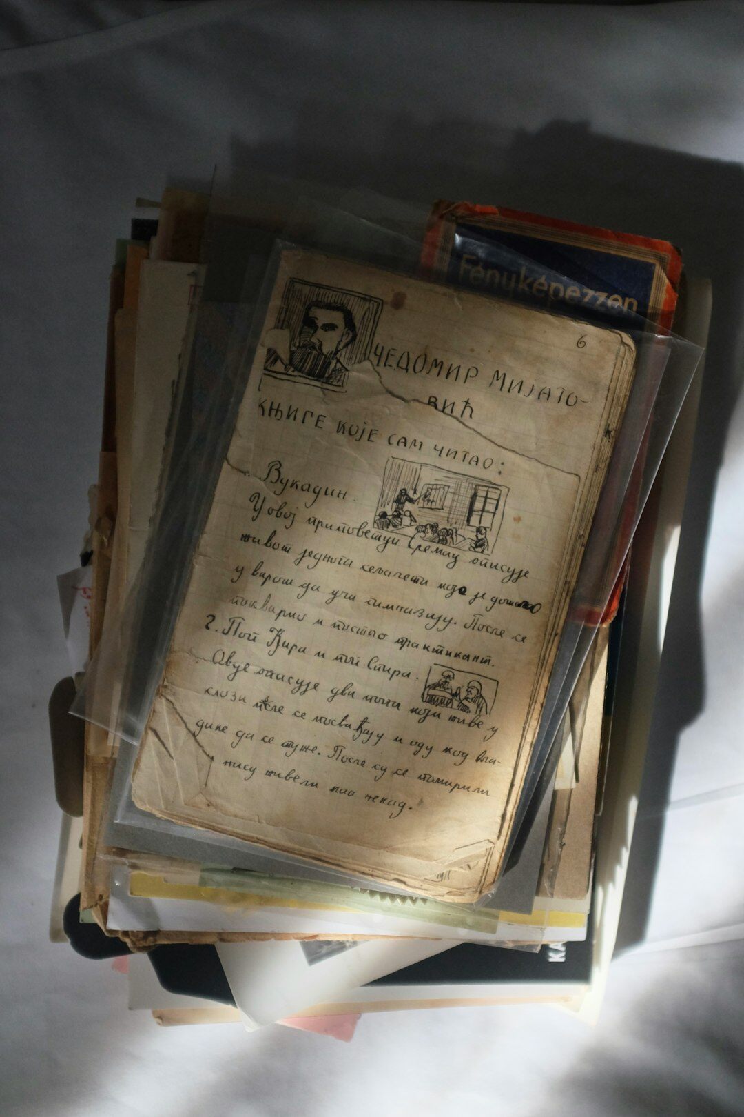 Stack of old magazine covers and contact sheets