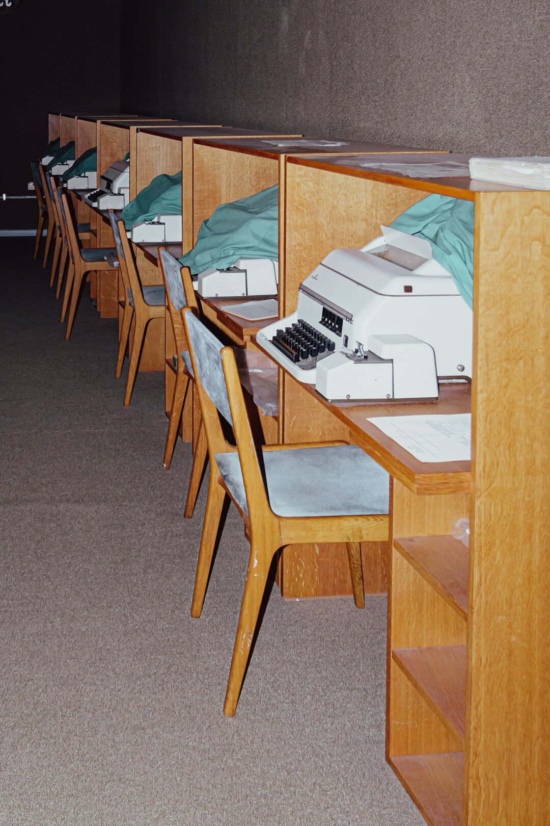 Editor's desk with typewriter, notebooks and printed photographs